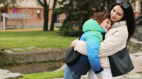 4K slow motion 60fps footage of a caring young caucasian mother embracing and Video stock 346644374