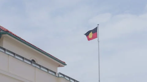 4K Slow Motion Of Aboriginal Indigenous Flag Waving In The Wind Against Stock Footage 238081107