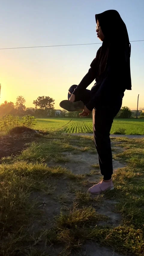 4K Slow Motion Active Muslim Woman in Hijab Warming Up and Stretching Before Jog Stock Footage 337999662
