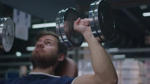 4k Slow Motion of Athlete Working Out Shoulders with Dumbbell Weights Stock Footage 185158035