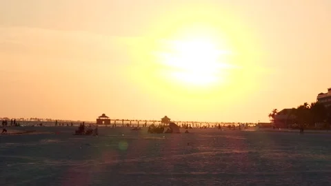 4K Slow Motion Beach Blanket Shaken out During End of Summer Day at Beach Pier Stock Footage 155409861