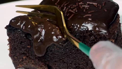 4K Slow Motion Bite of Chocolate Moist Cake with Rich Ganache Using a Fork Stock Footage 304652173