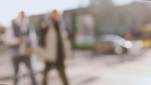 4K slow motion of blurred people walking on a sunny city street. Stock Footage 344555416