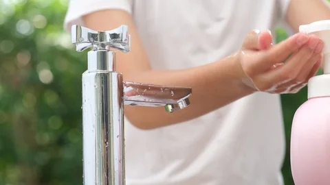 4k slow motion camera panning, close up kid hands use bubble soap Stock Footage 125896032