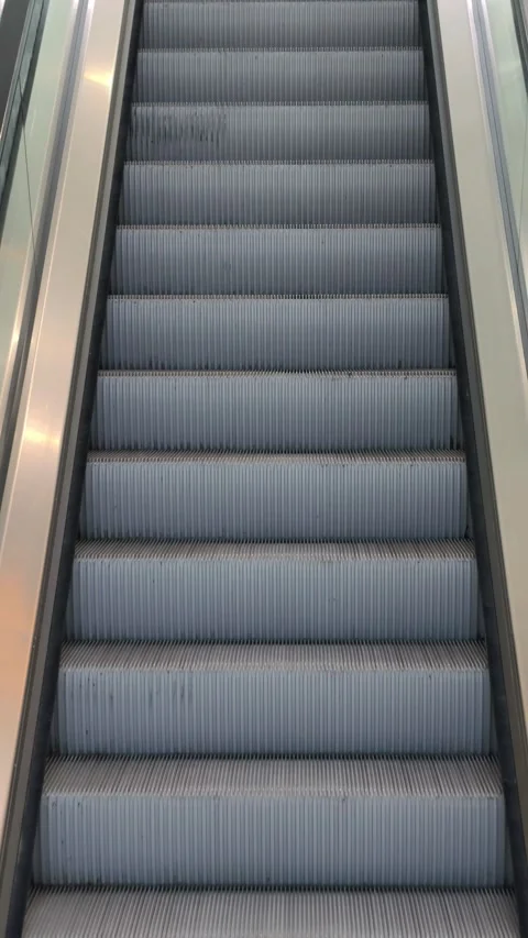 4K slow motion cinematic B-roll footage of escalator steps in shopping mall  Stock Footage 306238013