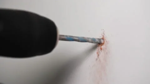 4K slow motion close-up video of a drill drilling a hole Stock Footage 165773687