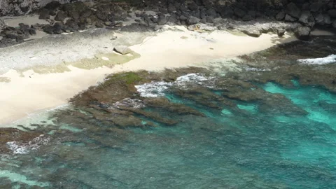 4K slow motion of crystal clear ocean water over coral reef in a lagoon 스톡 동영상 337087673