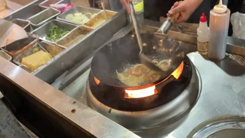 4K Slow Motion Editorial Video of Chef Making Stir Fry Shrimp on a Wok Pan Stock Footage 337228039
