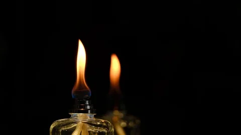4K slow motion flame of a flame from a scent diffuser in the dark Stock Footage 128174803