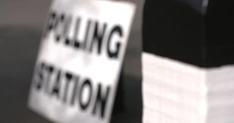 4k slow motion focus pull to polling station sign on election day Stock Footage 89815415
