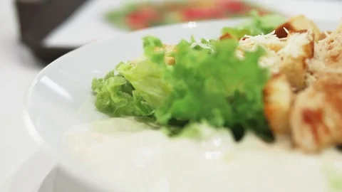 4k Slow Motion Fresh Caesar salad chicken, vegetables, eggs, lettuce, cheese Stock Footage 78763773