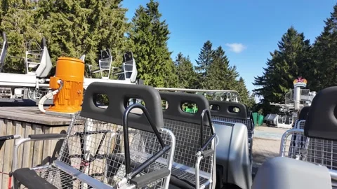 4K Slow Motion Glide On Mountain Chairlift Summer Video stock 333917480