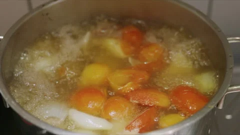4K Slow motion of hot soup boiling in a pot on home kitchen Stock Footage 337477132