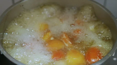 4K Slow motion of hot soup boiling in a pot on home kitchen stove Stock Footage 337477134