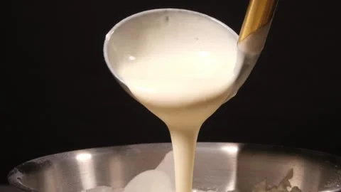 4K Slow Motion Ladle Scooping Batter Stock Footage 332507604