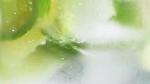 4K. Slow motion. Macro close-up,refreshing soda tonic fizzy water, lime, lemon Stock Footage 148161467