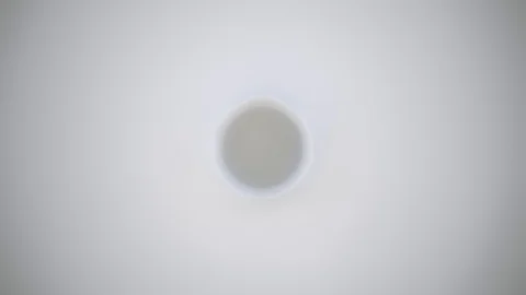 4k Slow-motion milk dropping and splashing forming a beautiful crown Stock Footage 87570802