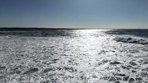 4K Slow Motion Ocean Waves with Sun Reflection Stock Footage 333704632