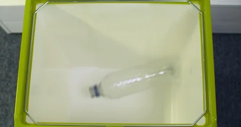 4k slow motion overhead shot of plastic bottles in recycle bin Vídeos de archivo 96536853