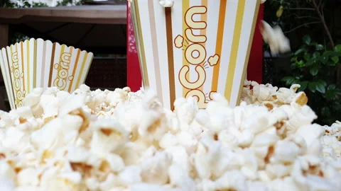 4K slow motion Pop Corn falls from above during party Stock Footage 135312873