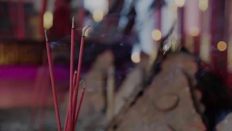 4K slow motion : Red burning incense burned with flames in the temple represents Stock Footage 120850519