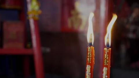 4K slow motion : Red candles are burning with flames in the temple. Stock Footage 120848415