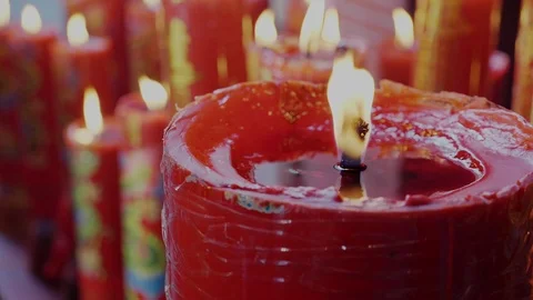 4K slow motion : Red candles are burning with flames in the temple. Stock Footage 120849029