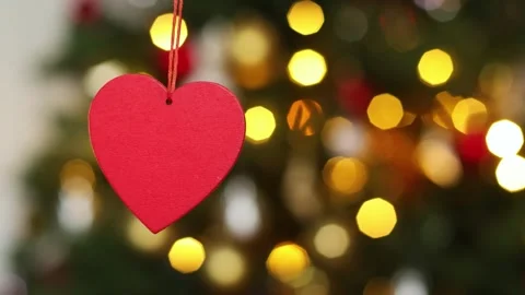 4K slow motion red heart hanging with glowing bokeh lights. Romantic festive 스톡 동영상 327239512