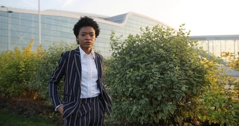 4k. Slow motion. Serious prety Afro-American businesswoman crosses her arms on Stock Footage 98296774