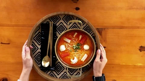 4K Slow Motion: Serving Steaming Hot Spicy Tom Yum Soup in Traditional bowl Stock Footage 338278289