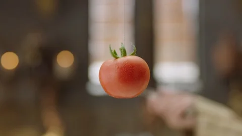 4K Slow Motion Shot of Cutting Tomato with Kitchen Knife Stock Footage 115863430