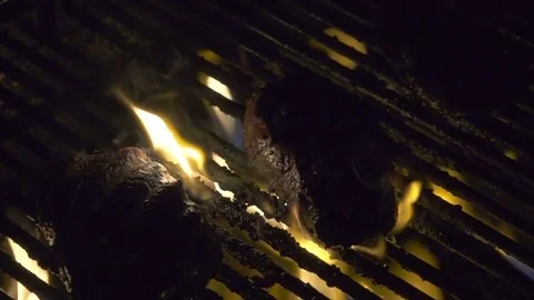 4k Slow Motion Steaks On Grill 3 Stock Footage 77195979