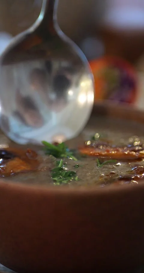 4K Slow-Motion Super Close-up of a Spoon Scooping Mushroom Soup. Stock Footage 286428363