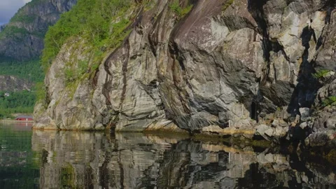 In a 4K slow-motion video, the bow of a boat frames a serene scene. Stock Footage 254021827