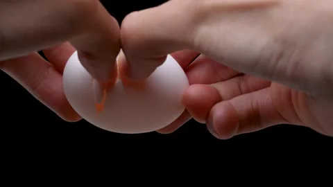 4K slow motion video of breaking an egg. Stock Footage 212492349