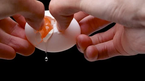 4K slow motion video of breaking an egg. Stock Footage 236086404