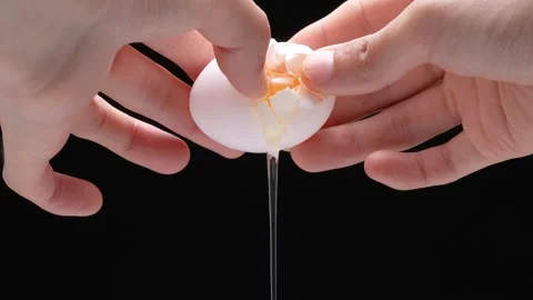 4K slow motion video of breaking an egg. Stock Footage 278390189