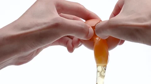 4K slow motion video of breaking an egg. Stock Footage 321925009
