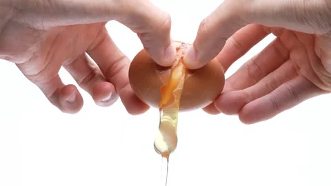 4K slow motion video of breaking an egg. Stock Footage 327120187