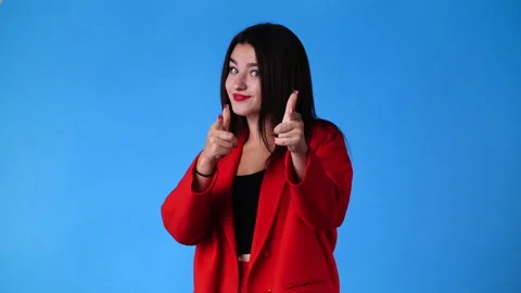 4k slow motion video of cute girl pointing at the camera and showing thumb up Stock Footage 227407386