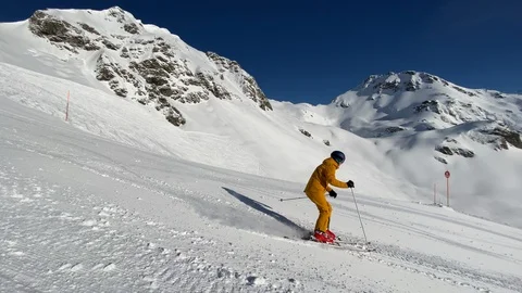4K slow motion video man skiing on ski slope Stock Footage 124546480
