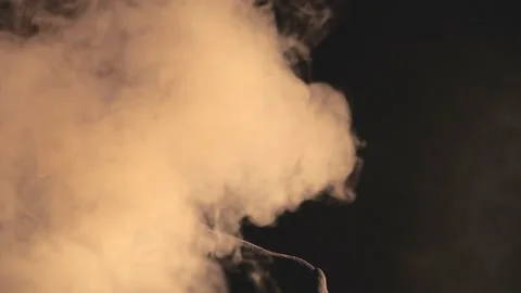 4k slow motion video of man turning around in smoke on black background. Stock Footage 189273845