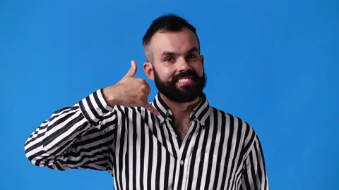 4k slow motion video of man making telephone gesture near head call me sign on Stock Footage 230661277