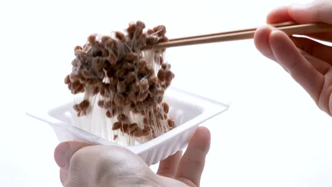 4K slow motion video of natto falling off chopsticks. Stock Footage 280094879
