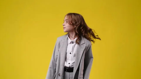 4k slow motion video of one girl looking right and left and pointing at left on Stock Footage 227223539