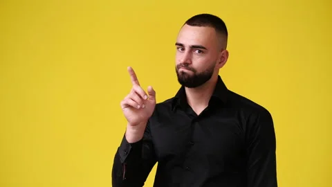 4k slow motion video of one man gesturing no over yellow background. Stock Footage 227506232