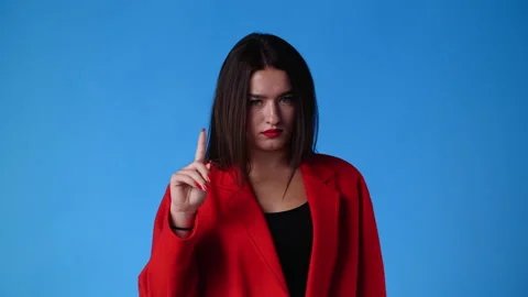 4k slow motion video of one woman gesturing no over blue background. Stock Footage 227507556