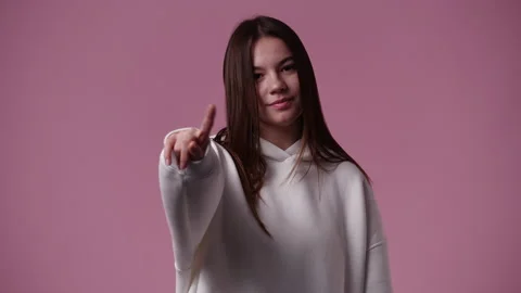 4k slow motion video of one girl gesturing no over pink background. Stock Footage 227509009