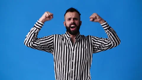4k slow motion video of one man being very emotional over blue background. Stock Footage 228401972