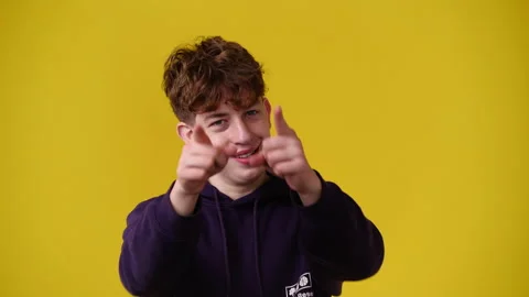 4k slow motion video of one man gesturing no over yellow background. Stock Footage 228402249